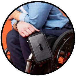 a small leather bag with wheelchair attachment connected to a person's wheelchair